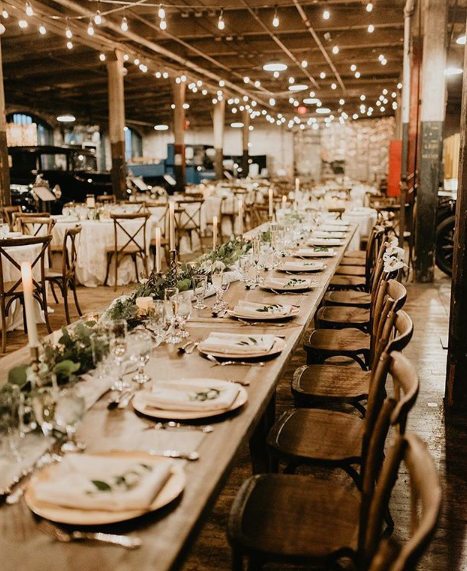 Rustic farm table setup at a wedding