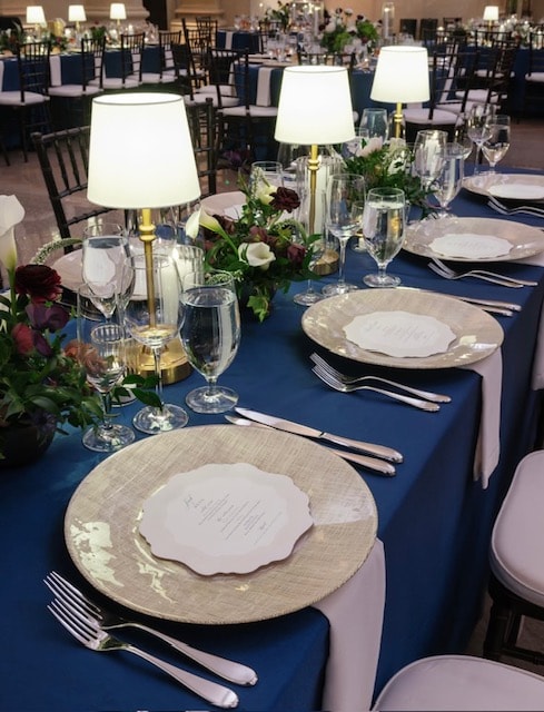 Luxury wedding reception tablescape with elegant linen