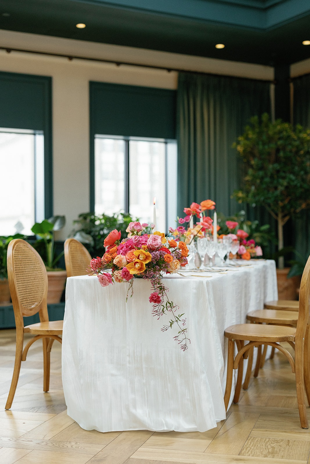 Grand wedding reception ballroom with elegant table setup