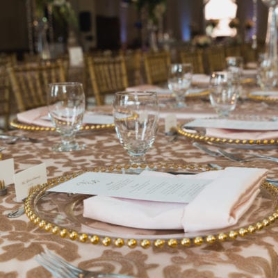 Nora Overlay Paired with Gold Beaded Glass Charger and Petal Napkin